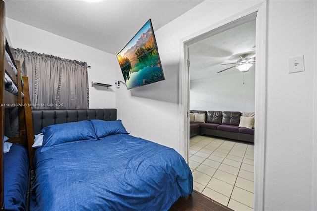 bedroom featuring ceiling fan and light tile patterned flooring