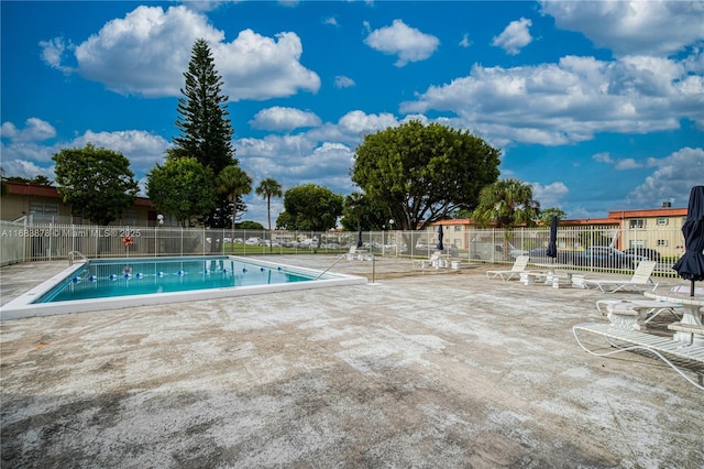 view of swimming pool with a patio