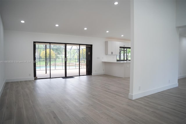 unfurnished living room featuring light hardwood / wood-style floors