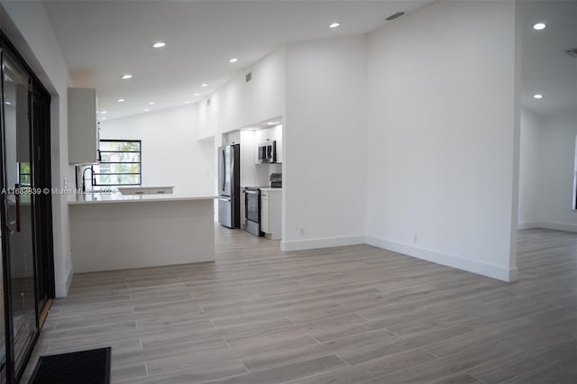 unfurnished living room featuring light hardwood / wood-style flooring