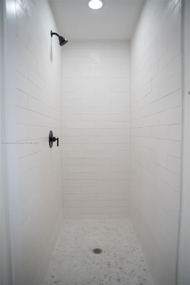 bathroom with a tile shower