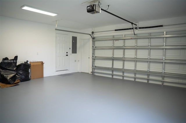 garage featuring a garage door opener and electric panel