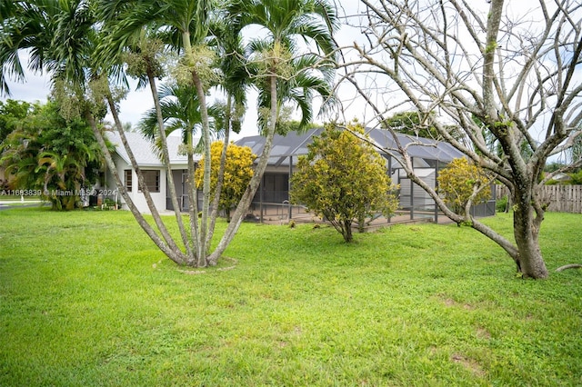 view of yard with a lanai