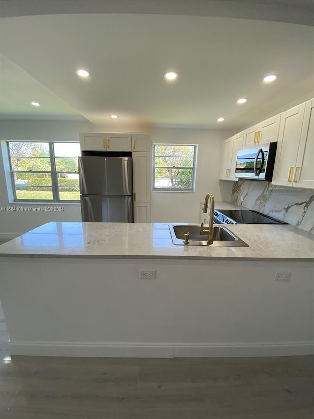 kitchen featuring white cabinetry, stainless steel appliances, dark wood-type flooring, and sink