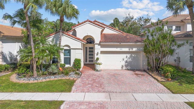 mediterranean / spanish-style house featuring a garage