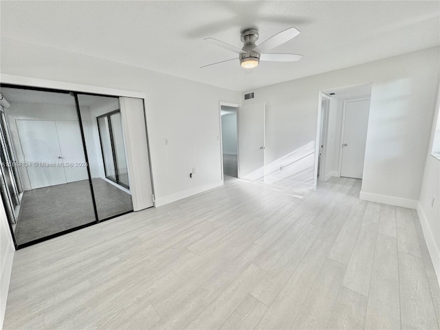 empty room featuring light hardwood / wood-style floors and ceiling fan