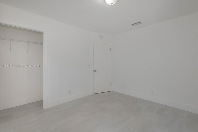 unfurnished bedroom featuring a closet