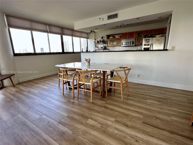 dining space featuring light hardwood / wood-style flooring