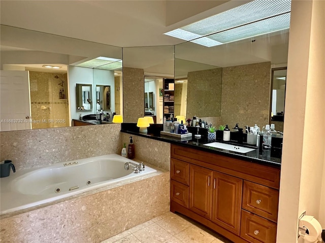 bathroom with vanity, tile patterned flooring, and shower with separate bathtub