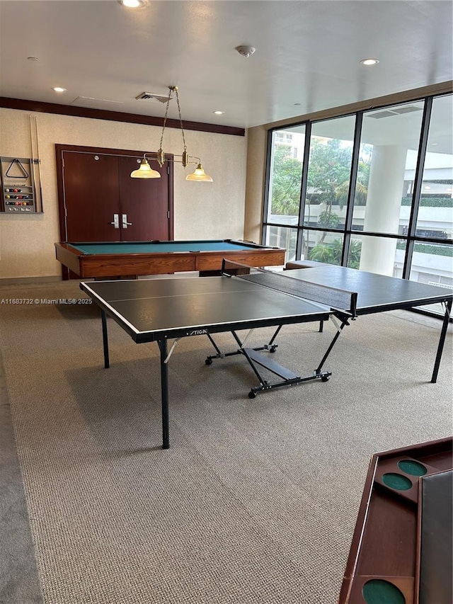 recreation room featuring billiards, expansive windows, and ornamental molding