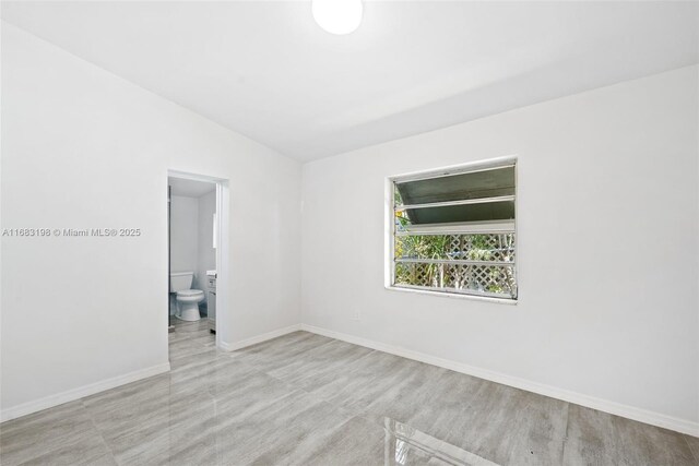 full bathroom with toilet, tiled shower / bath combo, and vanity