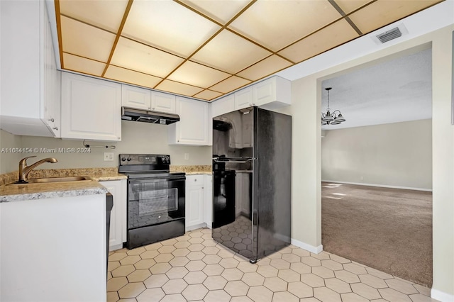 kitchen featuring white cabinets, light colored carpet, sink, and black appliances