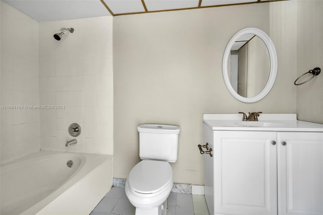 full bathroom featuring vanity, tile patterned flooring, tiled shower / bath, and toilet