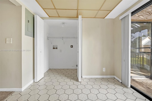 clothes washing area featuring electric panel and hookup for a washing machine