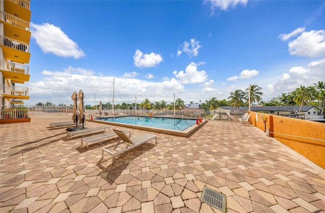 view of swimming pool featuring a patio area