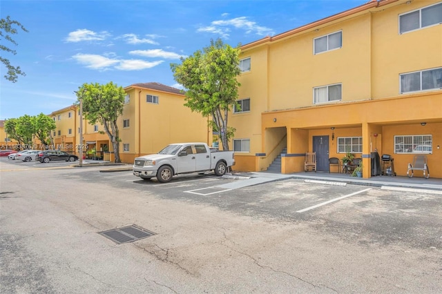 view of property with uncovered parking
