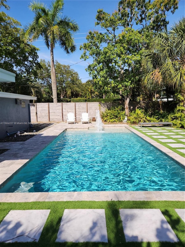 view of swimming pool featuring pool water feature