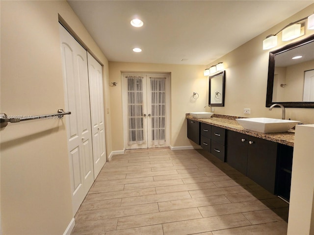 bathroom featuring french doors and vanity