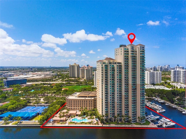 birds eye view of property with a water view