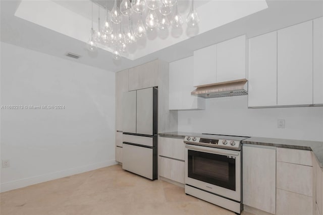 kitchen featuring white cabinets, exhaust hood, a chandelier, stainless steel electric range oven, and high end fridge