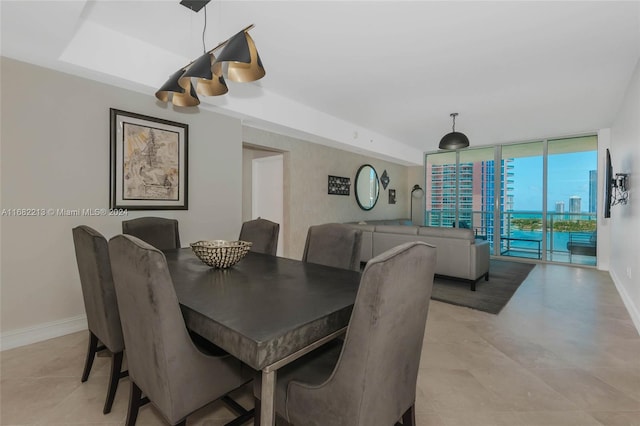 dining room featuring a wall of windows