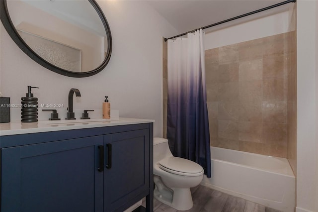 full bathroom with vanity, toilet, shower / tub combo, and hardwood / wood-style floors