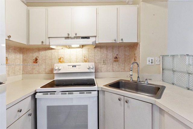 kitchen with white cabinetry, tasteful backsplash, white electric range oven, and sink