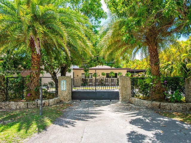 view of front facade with a carport and a garage