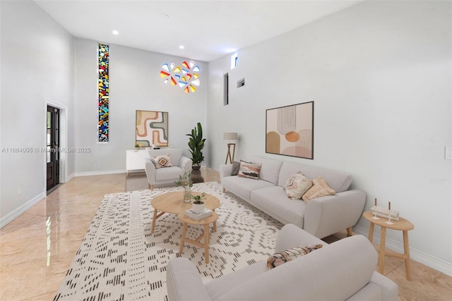 living room featuring a high ceiling