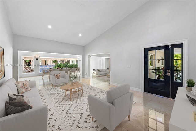 living room with recessed lighting, high vaulted ceiling, and baseboards