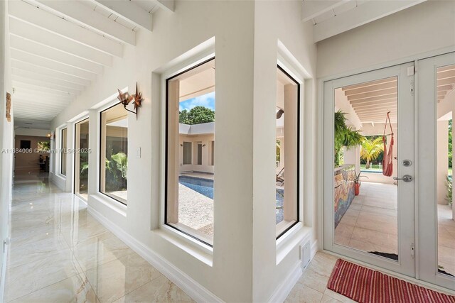 foyer with a notable chandelier and high vaulted ceiling