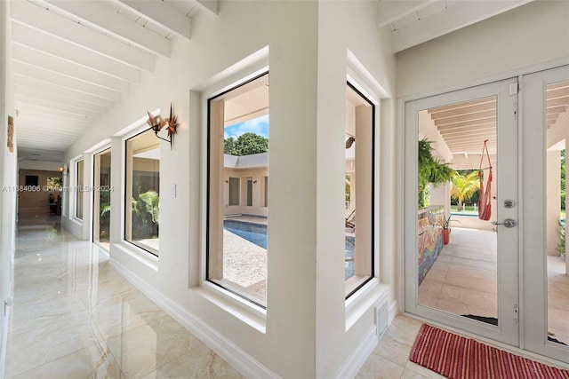 interior space featuring lofted ceiling with beams