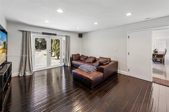 living room featuring dark hardwood / wood-style floors and french doors