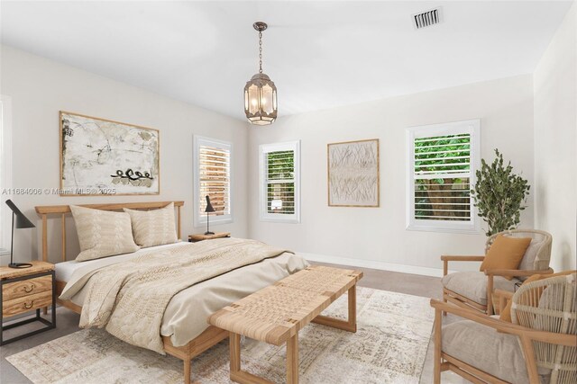 bedroom with a notable chandelier