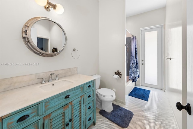 full bathroom with vanity, shower / tub combo, tile patterned flooring, and toilet