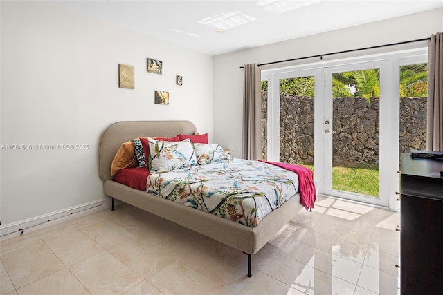 bedroom featuring french doors, light tile patterned flooring, and access to outside