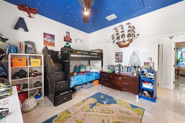 bedroom featuring visible vents, attic access, and marble finish floor