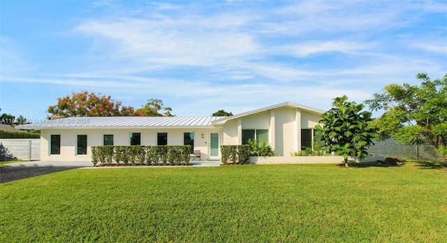 ranch-style house with a front lawn