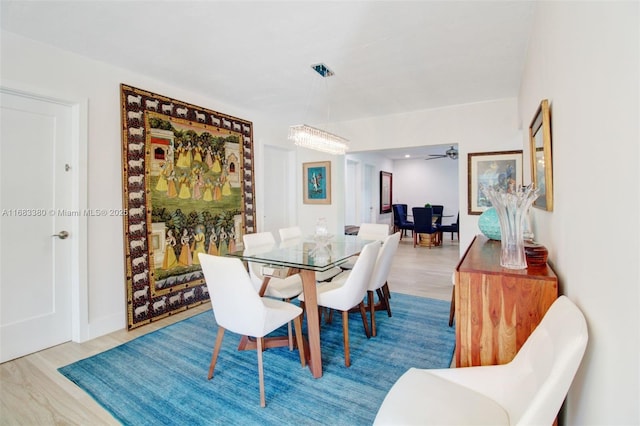 dining space with wood-type flooring