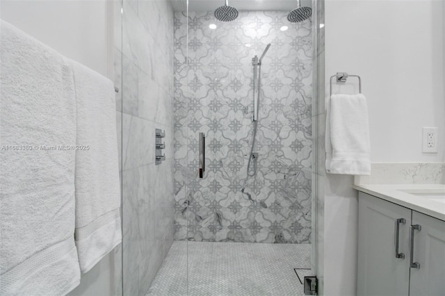 bathroom with vanity and a shower with shower door