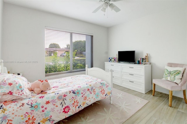 bedroom featuring ceiling fan and light hardwood / wood-style flooring