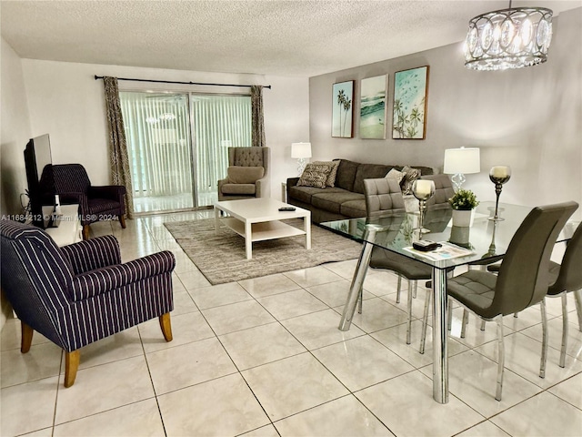 tiled living room featuring an inviting chandelier and a textured ceiling