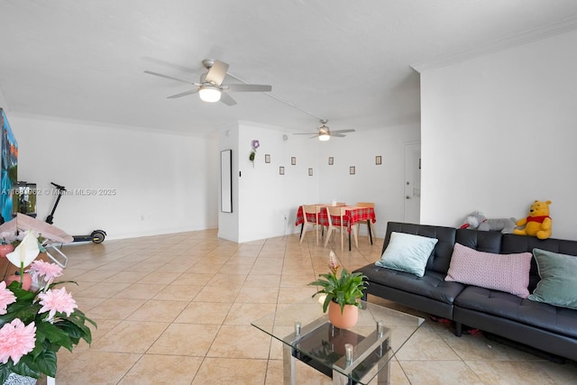 living room with ceiling fan, ornamental molding, and light tile patterned floors