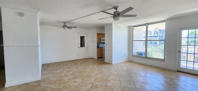 spare room featuring a textured ceiling and ceiling fan