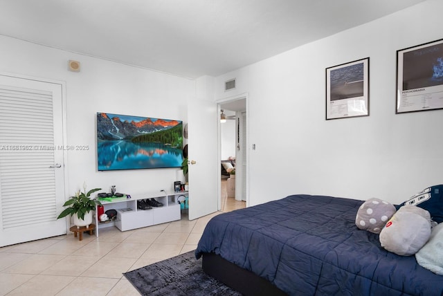 bedroom featuring visible vents and light tile patterned flooring