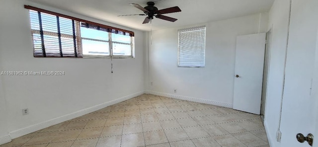 spare room with ceiling fan