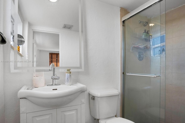 full bath with a shower stall, a textured wall, visible vents, and toilet