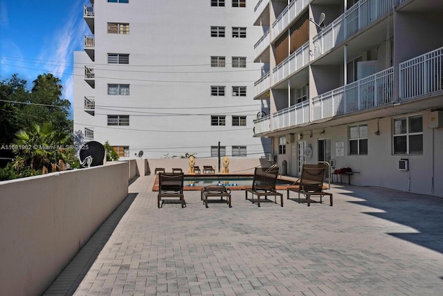 exterior space with a pool and a patio area