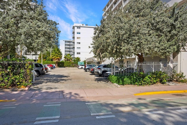 uncovered parking lot with fence