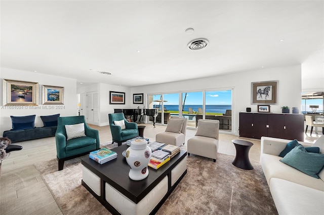 520 S Mashta Dr, Key Biscayne, FL 33149 - living area with wood finished floors and a water view
